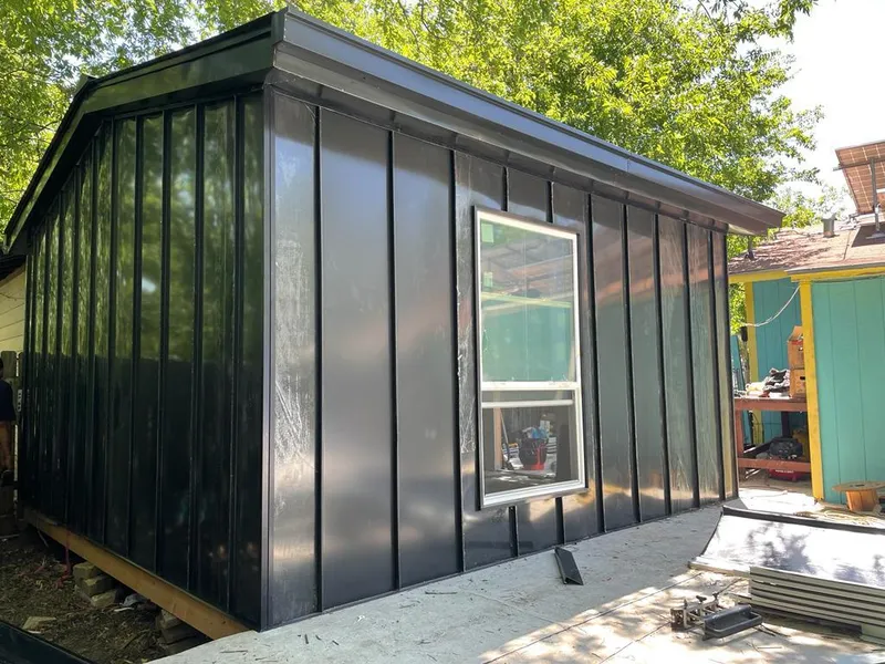 Black standing seam metal wall panels for Roof Inspection in Gautier